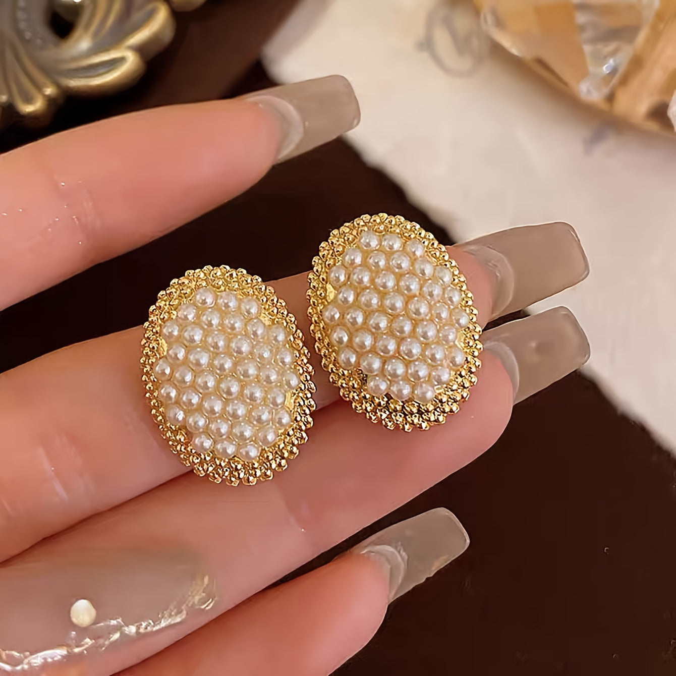 Gold and white stud earrings